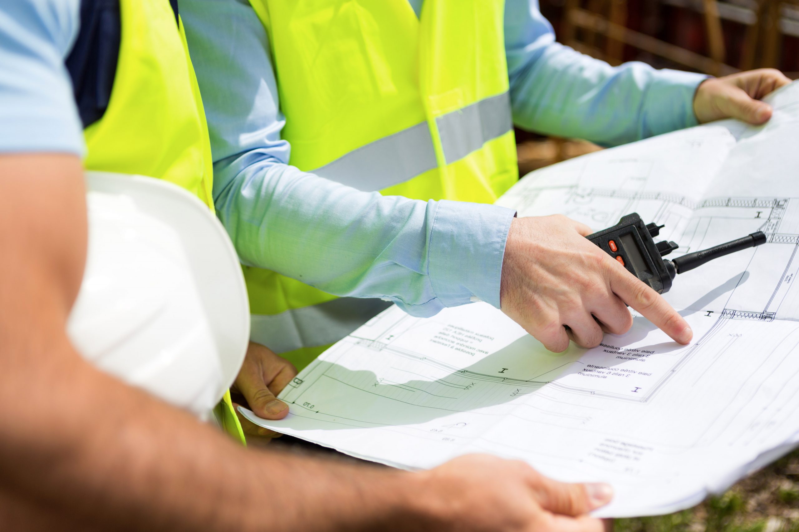 Detailed view of blueprints on a construction site